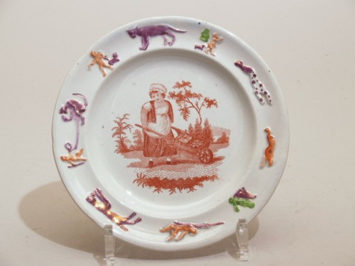Bord met bruin decor van vrouw met kruiwagen