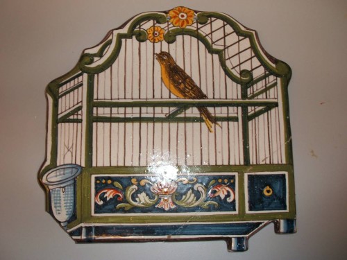 Plaat met vogelkooi